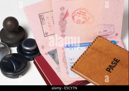 a stack of passports and stamps Stock Photo