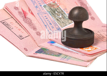 a stack of passports and stamp isolated on white Stock Photo