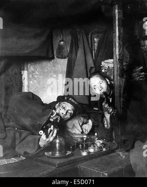 Smokers in an Opium Den in Chinatown, San Francisco United States circa 1909. See description for more information. Stock Photo