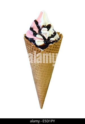 Strawberry and vanilla soft serve ice cream with chocolate topping in cone isolated on a white background. Stock Photo