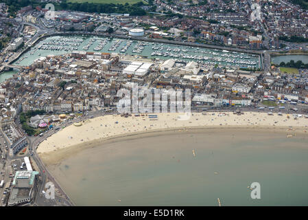 A wide aerial view of the beach at Weymouth showing the town and marina in Dorset, UK. Stock Photo