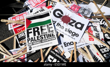 Free Palestine posters on the street during protest demonstration demo people demonstrating against bombing of Gaza Palestinians by Israel in London UK  19 July 2014  KATHY DEWITT Stock Photo