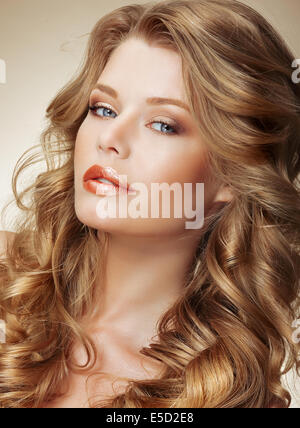 Styling. Gorgeous Fashion Model with Perfect Light Silky Hair Stock Photo