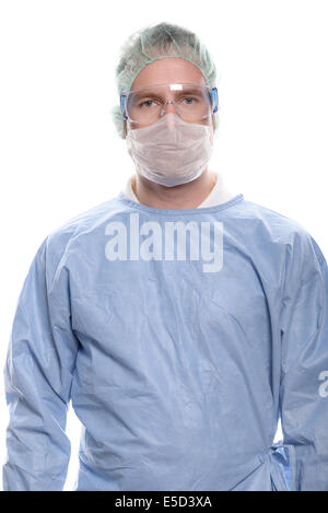 Male doctor, nurse or surgeon in blue scrubs standing facing the camera Stock Photo