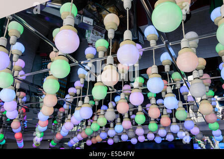 Multicoloured LED bulbs on a mirrored ceiling Stock Photo