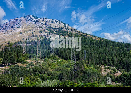 High voltage towers on a mountain landscape. Stock Photo