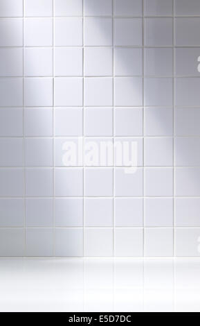 A vertical shot of a white tiled background or bathroom Stock Photo