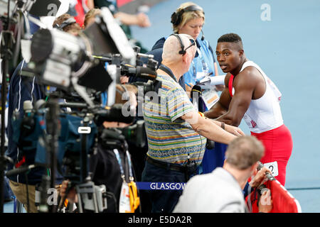 Glasgow, Scotland. 28th July, 2014. Glasgow 2014 Commonwealth Games Day 5. Athletics, Track and Field. Harry Aikines-Aryeetey of England speaks to the BBC after finishing 4th in the first Mens 100m Semi Final. Credit:  Action Plus Sports/Alamy Live News Stock Photo