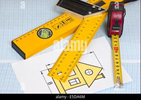 development drawings and tools on graph paper Stock Photo