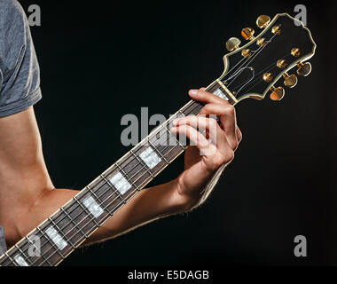 Guitarist playing blues photographed close-up hands and guitar, man is not recognizable Stock Photo