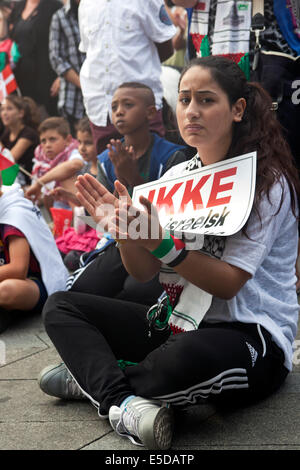 Copenhagen, Denmark. 28th July, 2014. Young Palestinian girl at the pro Palestinian demonstration in Copenhagen, which gather sSome 4 – 5000 people at the town hall square this afternoon. The demonstration was a protest against Israel’s bombing of Gaza. This happened simultaneously with Israel ‘s allegedly shelling of a refugee camp and a hospital in Gaza where several children died. The demonstration was organized by the Danish-Palestinian Friendship Association and Action Aid Denmark. Credit:  OJPHOTOS/Alamy Live News Stock Photo