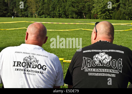 Two bald men sitting together Stock Photo