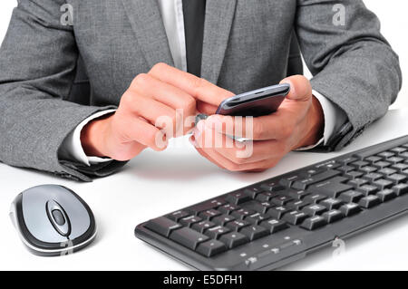 a young businessman using a smartphone in the office Stock Photo