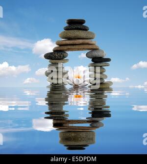 Lily flower and pebble. Isolated on white background Stock Photo - Alamy