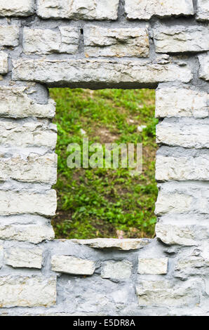 Window aperture in a wall from calcareous stones, a close up Stock Photo