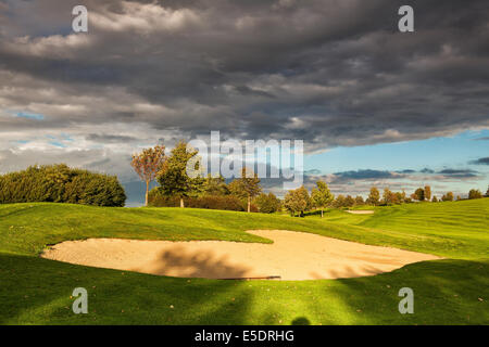 Summer golf course after storm at sunset Stock Photo
