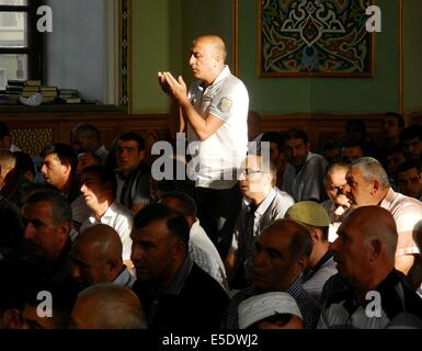 Baku, Azerbaijan. 29th July, 2014. Azerbaijani Muslims offer prayers to celebrate the Eid al-Fitr festival in capital Baku, on July 29, 2014. Azerbaijani Muslims celebrated the Eid al-Fitr festival, which marks the end of the Islamic holy month of Ramadan. Credit:  Tofik Babayev/Xinhua/Alamy Live News Stock Photo