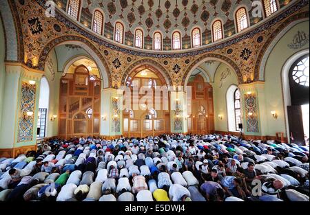 Baku, Azerbaijan. 29th July, 2014. Azerbaijani Muslims offer prayers to celebrate the Eid al-Fitr festival in capital Baku, on July 29, 2014. Azerbaijani Muslims celebrated the Eid al-Fitr festival, which marks the end of the Islamic holy month of Ramadan. Credit:  Tofik Babayev/Xinhua/Alamy Live News Stock Photo