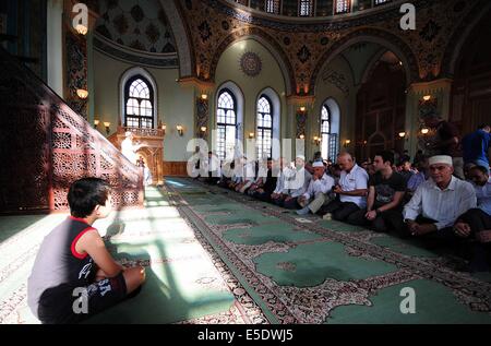 Baku, Azerbaijan. 29th July, 2014. Azerbaijani Muslims offer prayers to celebrate the Eid al-Fitr festival in capital Baku, on July 29, 2014. Azerbaijani Muslims celebrated the Eid al-Fitr festival, which marks the end of the Islamic holy month of Ramadan. Credit:  Tofik Babayev/Xinhua/Alamy Live News Stock Photo