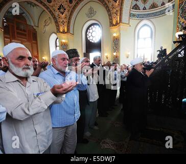 Baku, Azerbaijan. 29th July, 2014. Azerbaijani Muslims offer prayers to celebrate the Eid al-Fitr festival in capital Baku, on July 29, 2014. Azerbaijani Muslims celebrated the Eid al-Fitr festival, which marks the end of the Islamic holy month of Ramadan. Credit:  Tofik Babayev/Xinhua/Alamy Live News Stock Photo