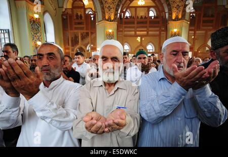 Baku, Azerbaijan. 29th July, 2014. Azerbaijani Muslims offer prayers to celebrate the Eid al-Fitr festival in Baku, Azerbaijan, on July 29, 2014. Azerbaijani Muslims celebrated the Eid al-Fitr festival, which marks the end of the Islamic holy month of Ramadan. Credit:  Tofik Babayev/Xinhua/Alamy Live News Stock Photo