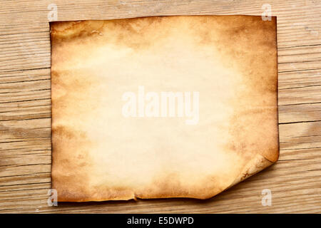 Single old paper on a wood table Stock Photo