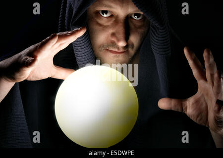 Sorcerer with glowing magical sphere close-up Stock Photo