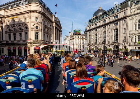 A London Tour Bus Passes By Piccadilly Circus, London, England Stock Photo