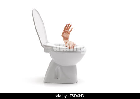Hands arising from a toilet bowl Stock Photo