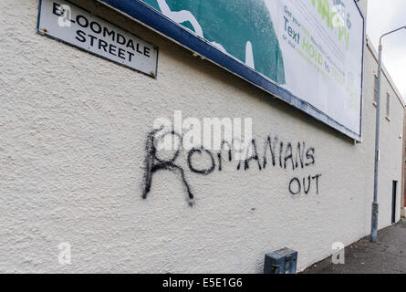 Belfast, Northern Ireland. 29th July, 2014. 'Romanians Out' graffiti spraypainted  on a wall in Belfast. Credit:  Stephen Barnes/Alamy Live News Stock Photo