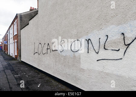 Belfast, Northern Ireland. 29th July, 2014. 'Locals Only' graffiti spraypainted  on a wall in Belfast. Credit:  Stephen Barnes/Alamy Live News Stock Photo