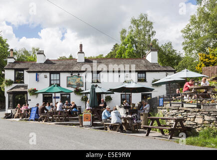 The Britannia Inn, a whitewashed free house country pub in the village of Elterwater, Lake District, Cumbria Stock Photo