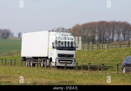 A Volvo truck traveling along the A417 dual carriageway in The Cotswolds, England Stock Photo