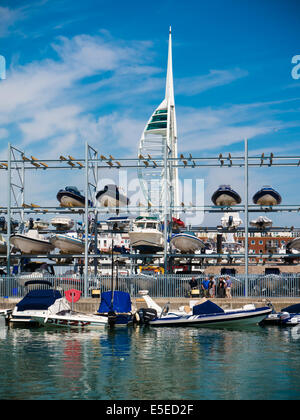 Multi storey boat rack holding Rigid inflatable boats at Camber Docks in Old Portsmouth. Stock Photo