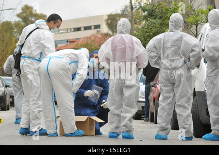 30 December 2010 - Athens, Greece - Forensic police officers gather evidence at the scene of a bomb attack on a court building i