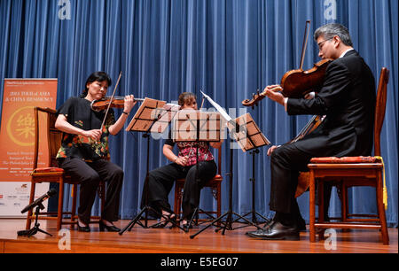 Washington, DC, USA. 29th July, 2014. Musicians of Philadelphia Orchestra perform after a press conference at the Chinese Embassy in the United States in Washington, DC, capital of the United States, July 29, 2014. The Philadelphia Orchestra on Tuesday said that it will stage a concert in November to mark the 35th anniversary of establishment of China-U.S. diplomatic relations. © Bao Dandan/Xinhua/Alamy Live News Stock Photo