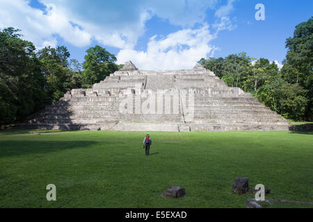 Tourist in front of the Caana pyramid at Caracol - an ancient Maya city, Cayo, Belize, Central America Stock Photo