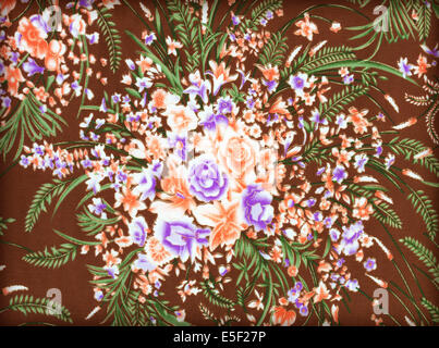 Fragment of colorful retro tapestry textile pattern with floral ornament useful as background Stock Photo