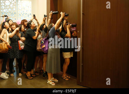 Fans of Yunho (TVXQ), Jul 29, 2014 : Fans of idol group TVXQ's Yunho (not pictured), who are from Japan, China and the U.S., take photos between the doors while Yunho attends a presentation of his new drama 'The Night Watchman's Journal' in Seoul, South Korea. © Lee Jae-Won/AFLO/Alamy Live News Stock Photo