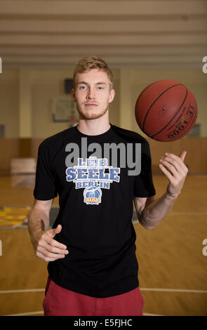 New player of German Bundesliga basketball team ALBA Berlin Niels Giffey poses in Berlin, Germany, 30 July 2014. Giffrey will play for ALBA for the next three years. Photo: Joerg Carstensen/dpa Stock Photo