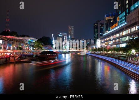 Electric Clarke Quay and the Singapore River at night.  Singapore. Stock Photo