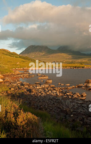 Storm Clouds approaching Sgorr Tuath on Loch Lurgainn Stock Photo