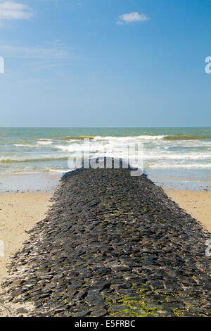 A pier, breaking the waves of the North sea on the dutch island Vlieland Stock Photo