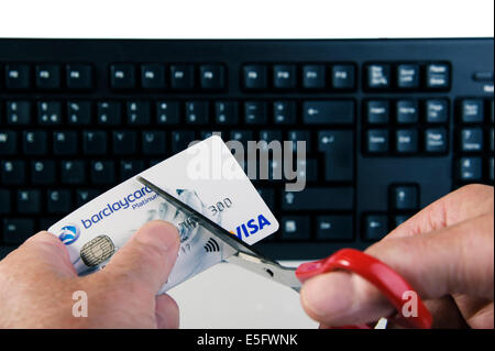 Adult male cutting credit card up. Stock Photo