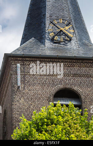 Camouflaged antenna showing brick pattern from base station for mobile telephony on church tower Stock Photo