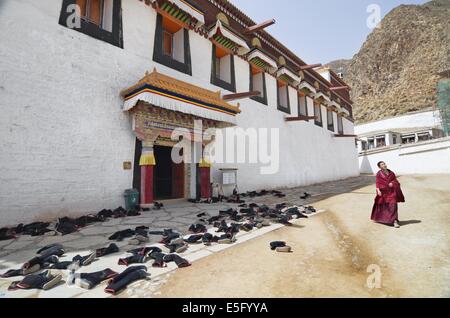 Labrang Pile Monks took their shoes off before entering the prayer hall in the ...