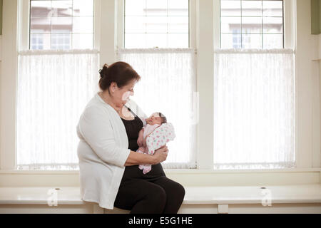 Grandmother with newborn granddaughter (0-1 month) Stock Photo