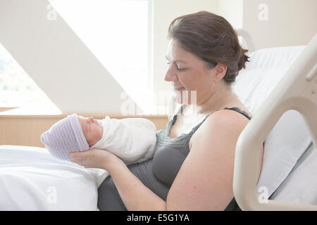 Mother holding daughter (0-1 month) Stock Photo