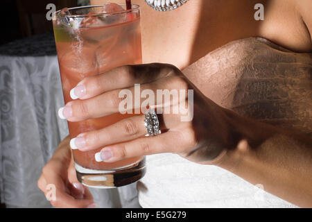 Mid section of bride holding drink, Gloucester, Gloucestershire, England, UK Stock Photo