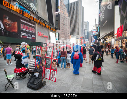 Costumed characters swarm Times Square in New York begging for tips Stock Photo